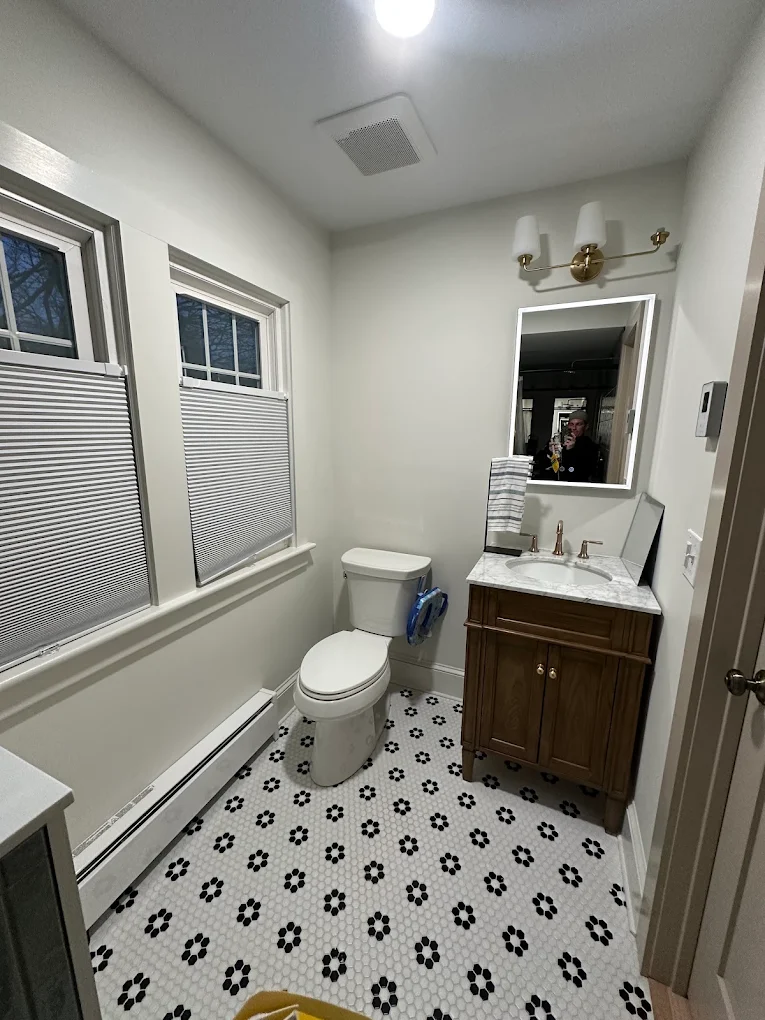 Bathroom with soft gray walls and bright white trim