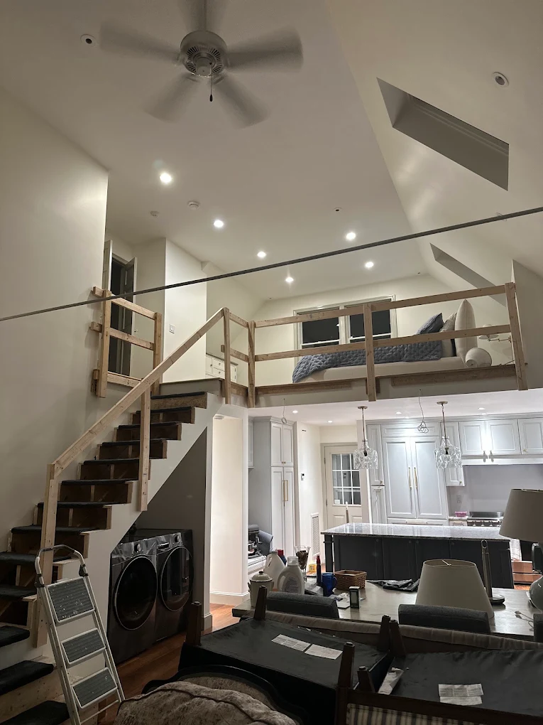 Open loft project with temporary wood safety rails