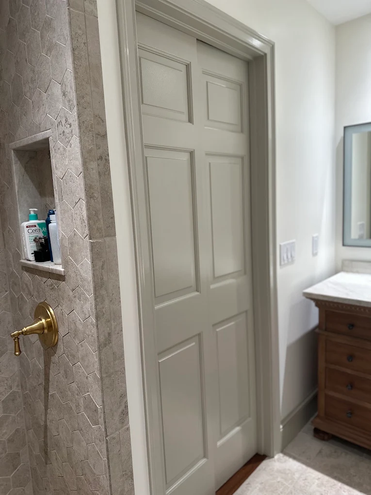 Bathroom doorway and trim painted a warm gray