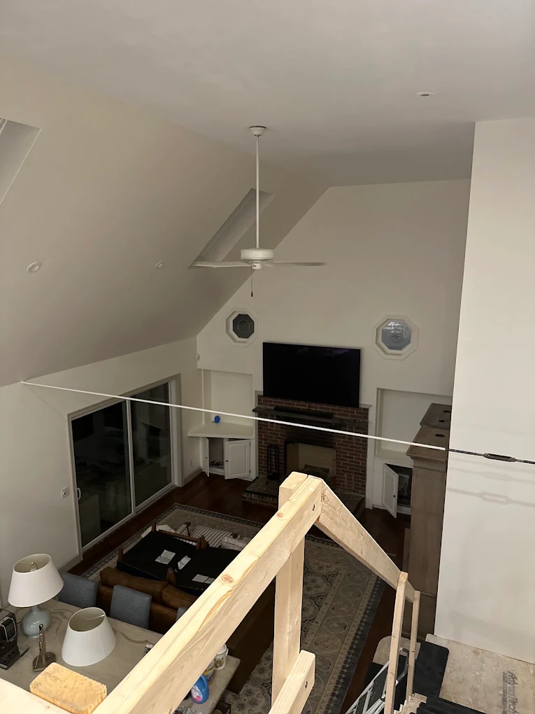 Vaulted living room with fresh white walls and ceiling