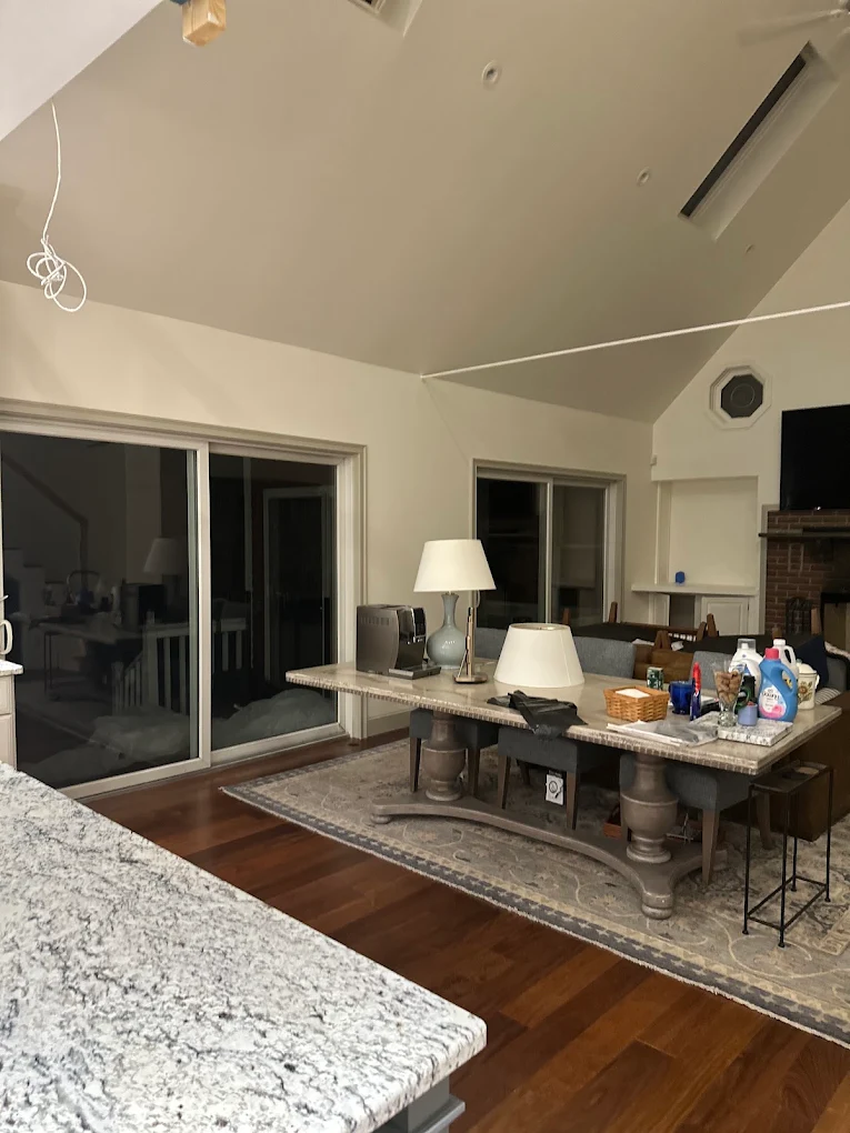 Open living area with freshly painted walls and vaulted ceiling