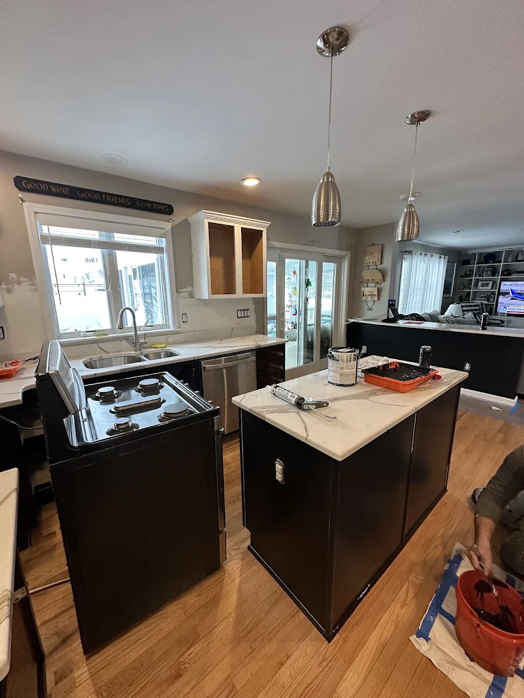 Kitchen cabinets being refinished with a fresh coat of paint